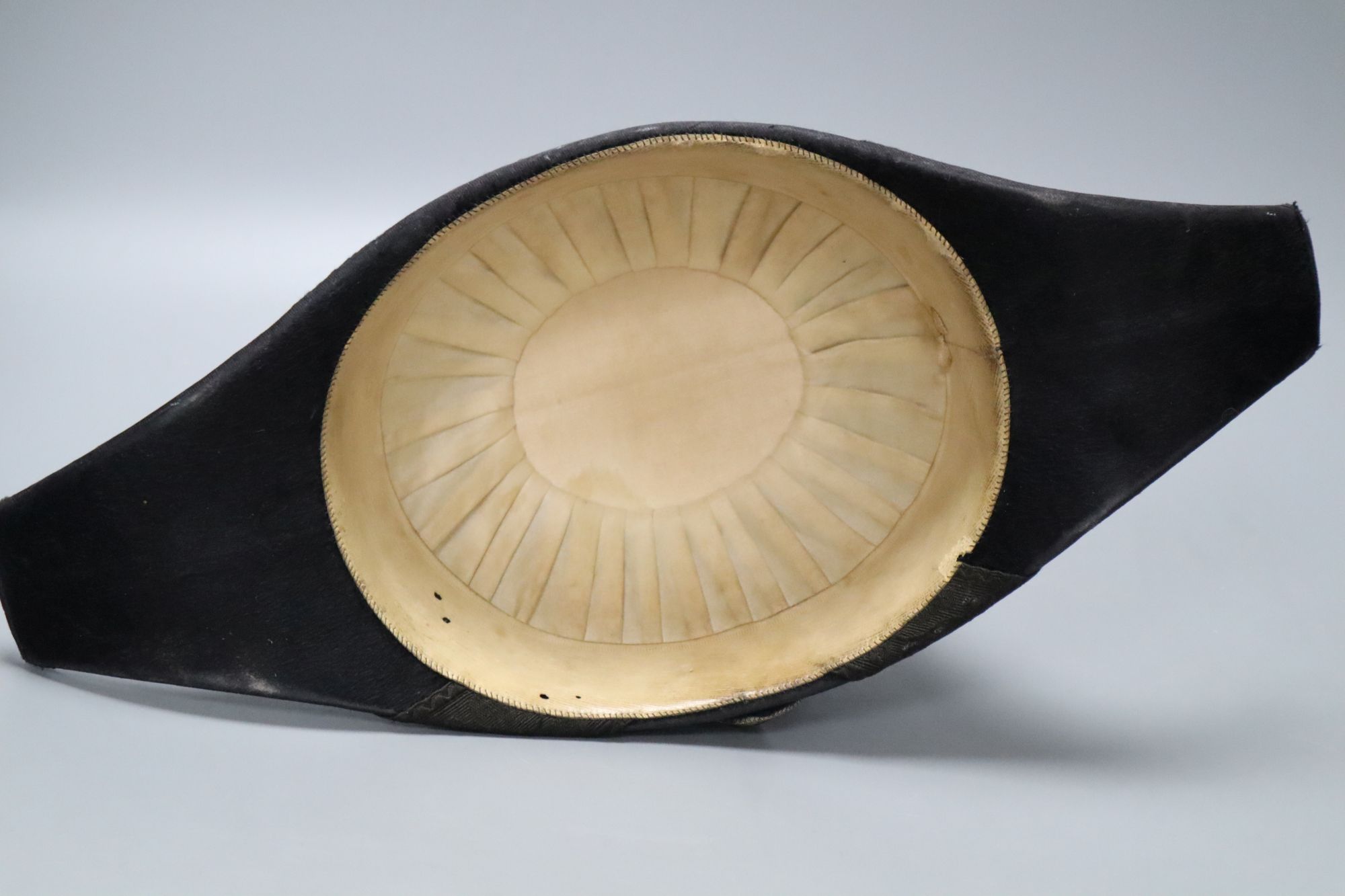 A WWI bicorn naval hat with Kings crown button
